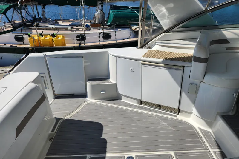 Slide: The Image of Luxurious seating area on a 2000 Formula 41 Performance Cruiser yacht at the marina. - 20