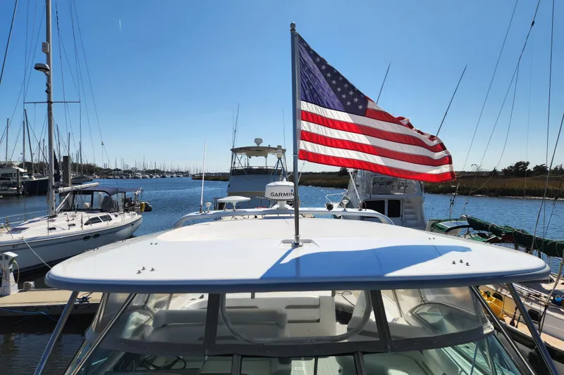 Slide: The Image of 2000 Formula 41 Performance Cruiser helm with Garmin navigation, steering wheel, and control panel. - 27