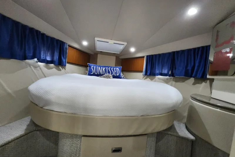 Slide: The Image of Interior of 2000 Formula 41 Performance Cruiser with modern kitchen and cozy seating area. - 33