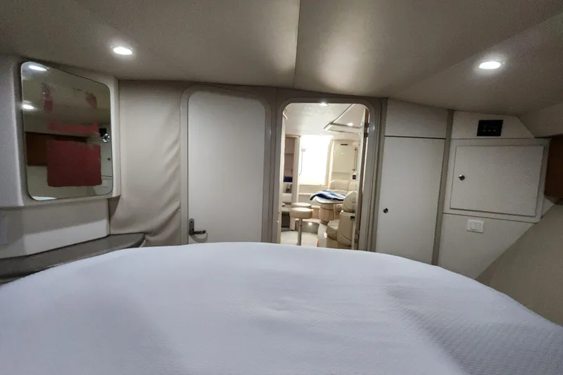 Slide: The Image of Interior of 2000 Formula 41 Performance Cruiser with beige leather seating and table. - 34