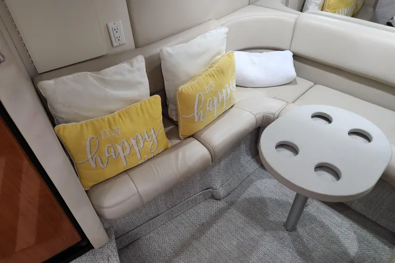 Slide: The Image of Cozy cabin interior of 2000 Formula 41 Performance Cruiser with "Sunkissed" pillow and blue curtains. - 37