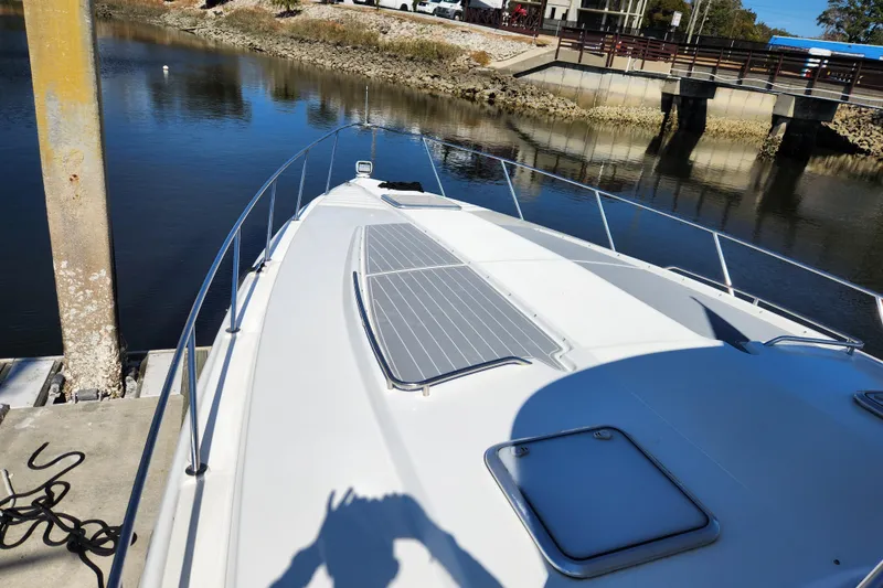 Slide: The Image of Bow view of 2000 Formula 41 Performance Cruiser on calm water. - 4