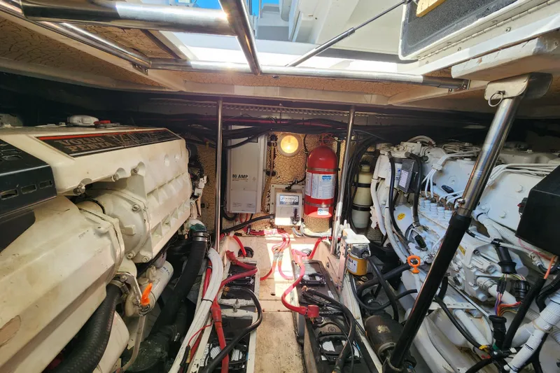 Slide: The Image of Interior of 2000 Formula 41 Performance Cruiser with beige seating and decorative pillows. - 41