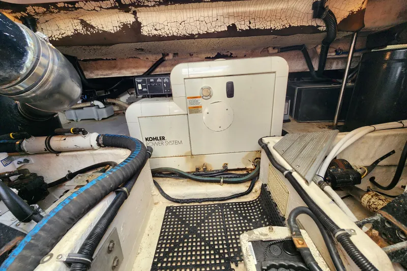 Slide: The Image of Interior of 2000 Formula 41 Performance Cruiser with beige seating and table. - 42