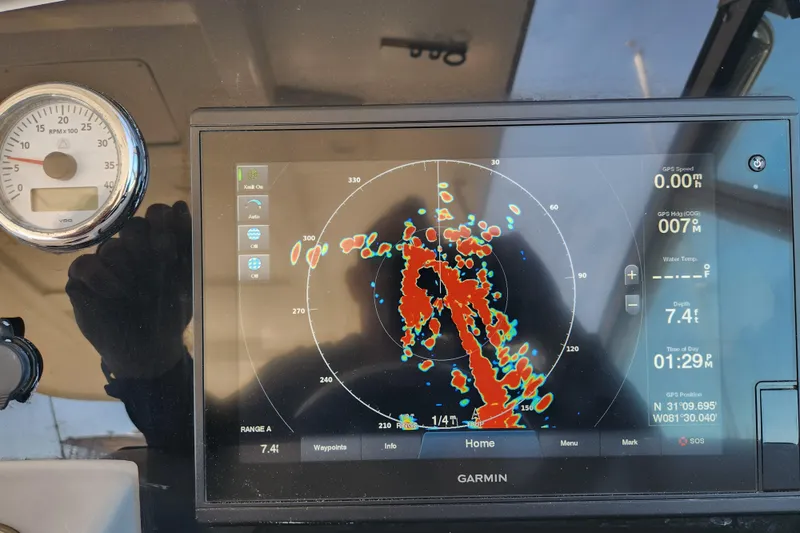 Slide: The Image of Garmin navigation display on 2000 Formula 41 Performance Cruiser, showing radar and GPS data. - 49