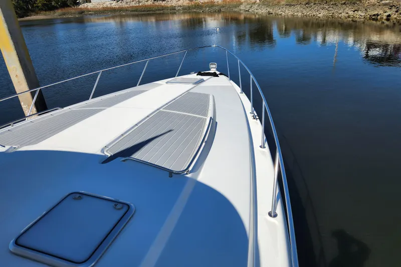 Slide: The Image of 2000 Formula 41 Performance Cruiser on calm water, showcasing sleek deck design. - 6