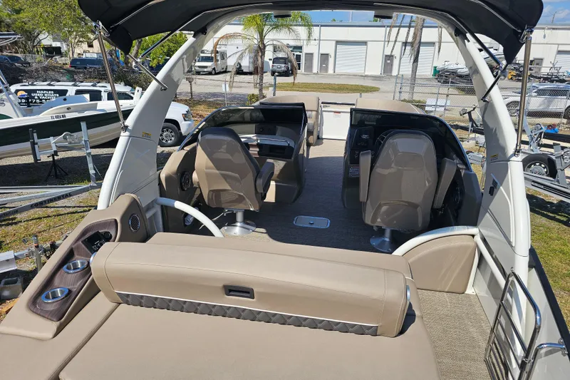 Slide: The Image of 2025 Bennington QX 27 QXSBWA X2 Swingback interior with seating and helm. - 33