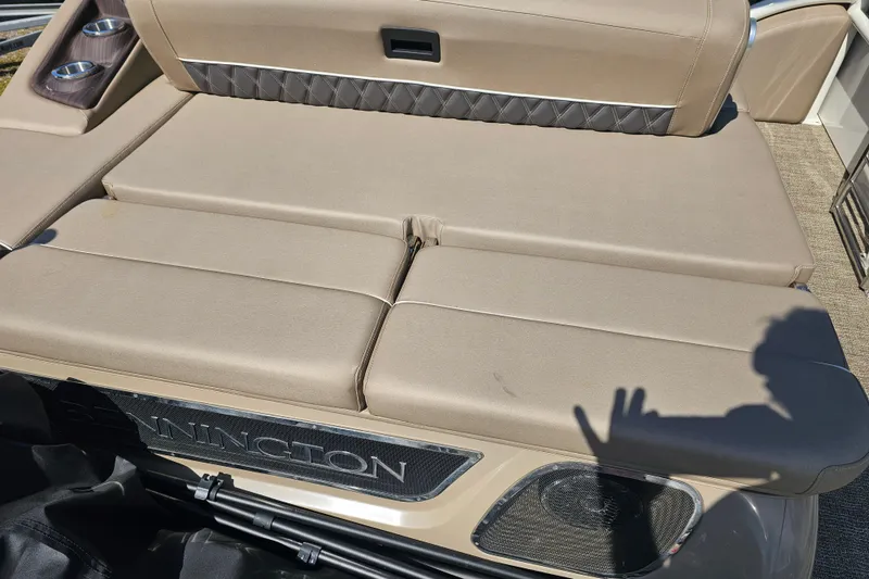 Slide: The Image of 2025 Bennington QX 27 QXSBWA X2 Swingback with beige seating and cup holders. - 34