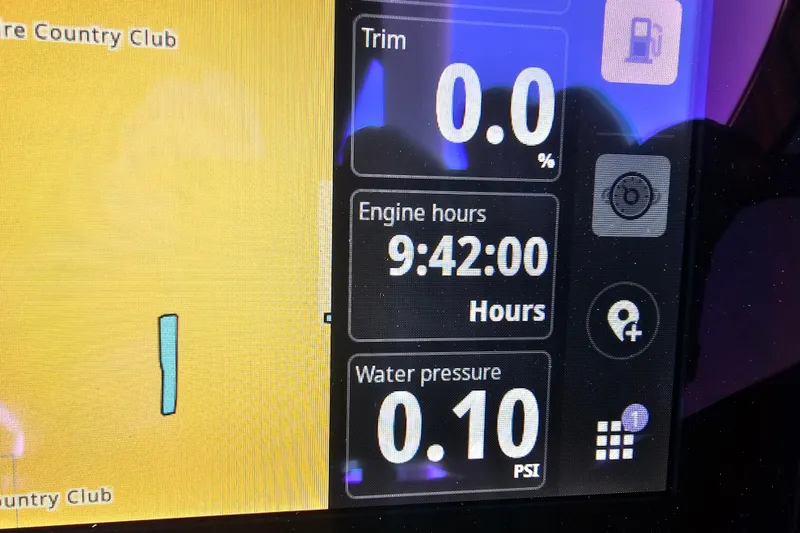 Slide: The Image of Display panel of 2025 Bennington QX 27 QXSBWA X2, showing engine hours and water pressure. - 36