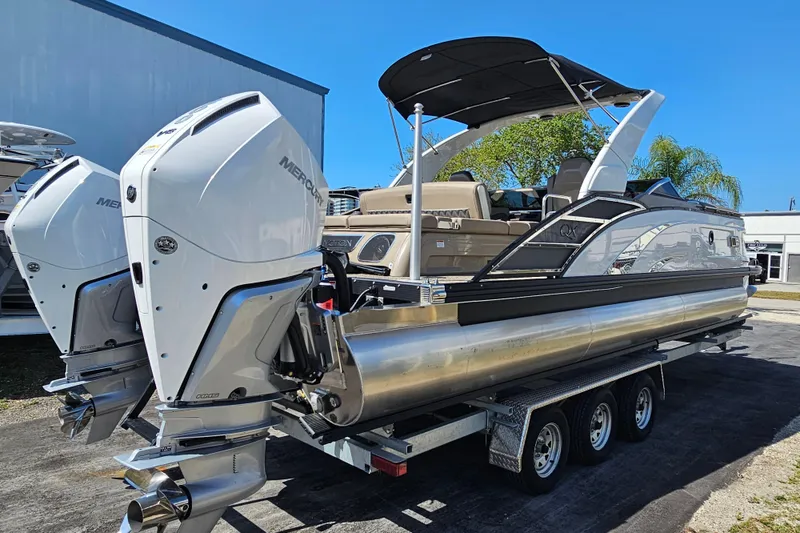 Slide: The Image of 2025 Bennington QX 27 QXSBWA X2 Swingback pontoon boat with dual Mercury outboard engines. - 4