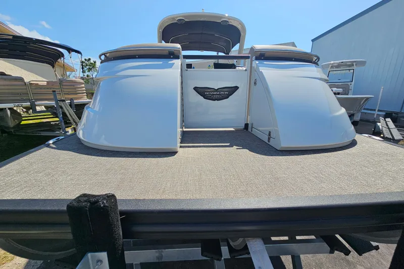 Slide: The Image of 2025 Bennington QX 27 QXSBWA X2 Swingback pontoon boat, rear view on trailer. - 8