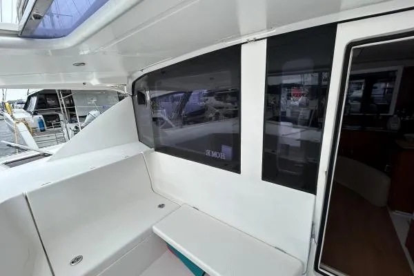 Slide: The Image of 2014 Leopard 44 catamaran interior with seating and window view. - 18