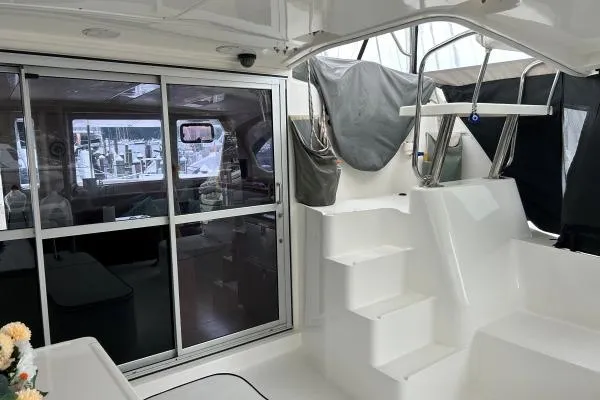 Slide: The Image of Interior view of 2014 Leopard 44 catamaran with sliding glass doors and white steps. - 20
