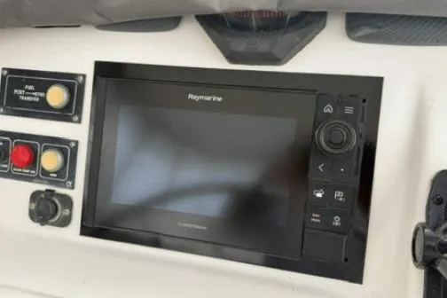 Slide: The Image of Control panel of a 2014 Leopard 44 yacht featuring a Raymarine display. - 28