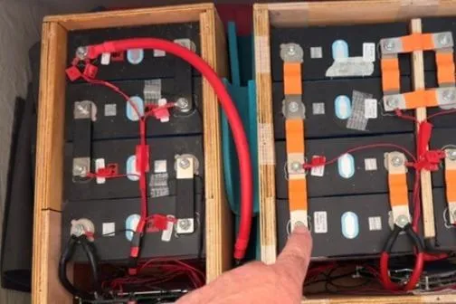 Slide: The Image of Battery setup in a 2014 Leopard 44, featuring wiring and connections. - 32