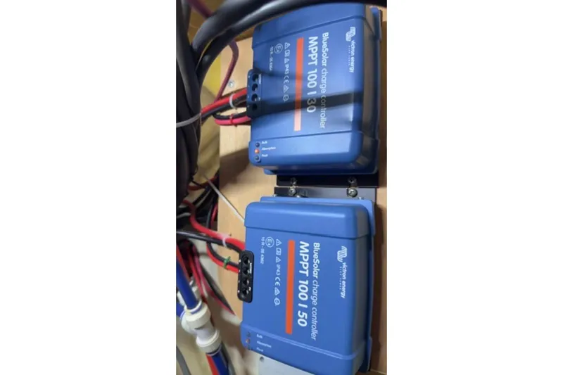 Slide: The Image of BlueSolar charge controllers in a Leopard 44, 2014 model, with wiring connections. - 38