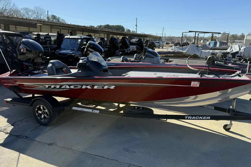 The Image of 2021 Tracker Pro Team 190 TX boat on trailer in outdoor showroom. - 0