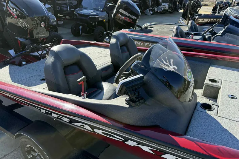 Slide: The Image of 2021 Tracker Pro Team 190 TX boat interior with steering console and seating. - 3