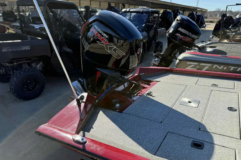 Slide: The Image of 2021 Tracker Pro Team 190 TX boat with Mercury Pro XS engine in a showroom. - 4