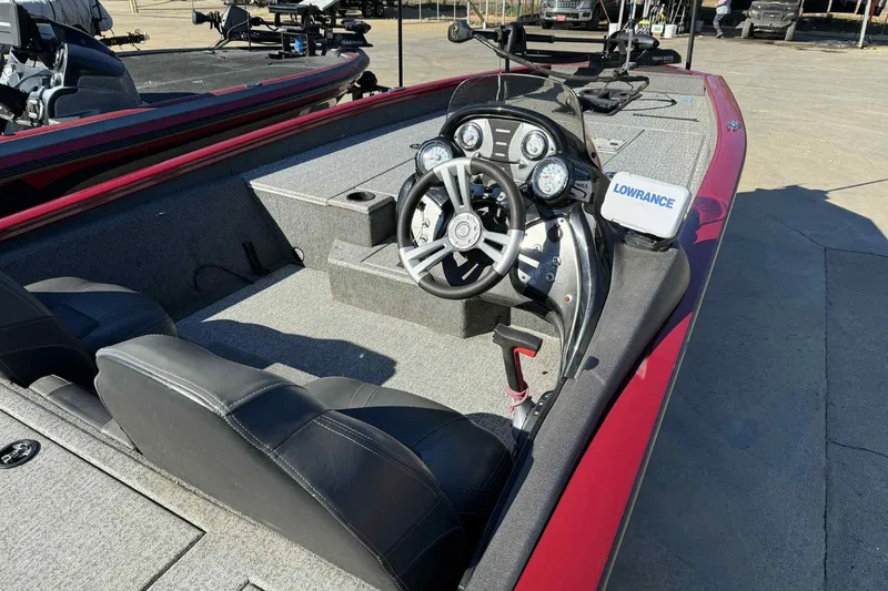 Slide: The Image of 2021 Tracker Pro Team 190 TX boat interior with steering wheel and Lowrance device. - 5