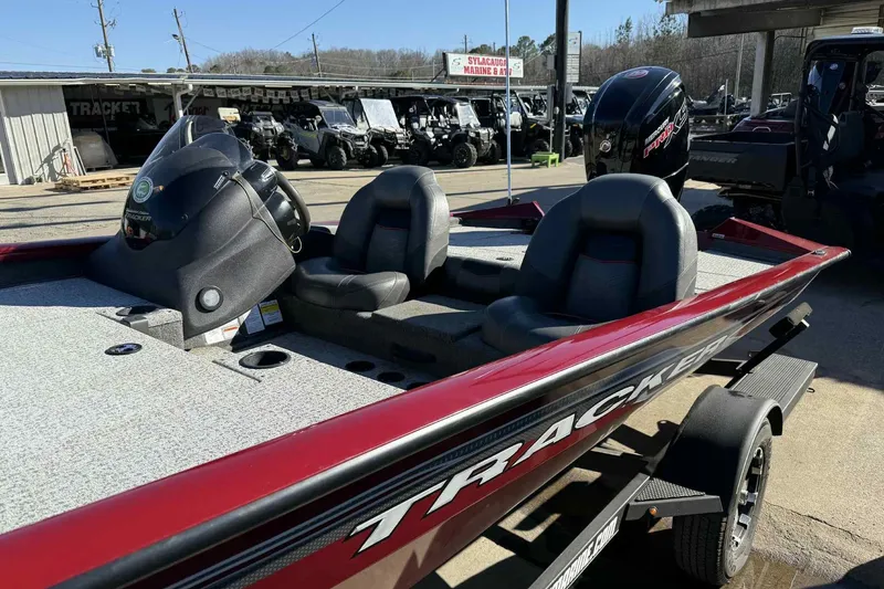 Slide: The Image of 2021 Tracker Pro Team 190 TX boat with dual seats and outboard motor. - 7