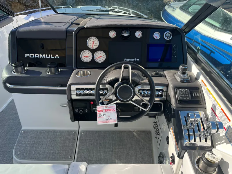 Slide: The Image of 2024 Formula 330 CBR boat cockpit with modern controls. - 5