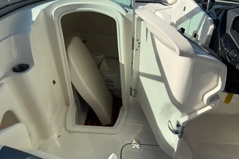 Slide: The Image of 2011 Monterey 264 FS boat interior with open storage compartment. - 15