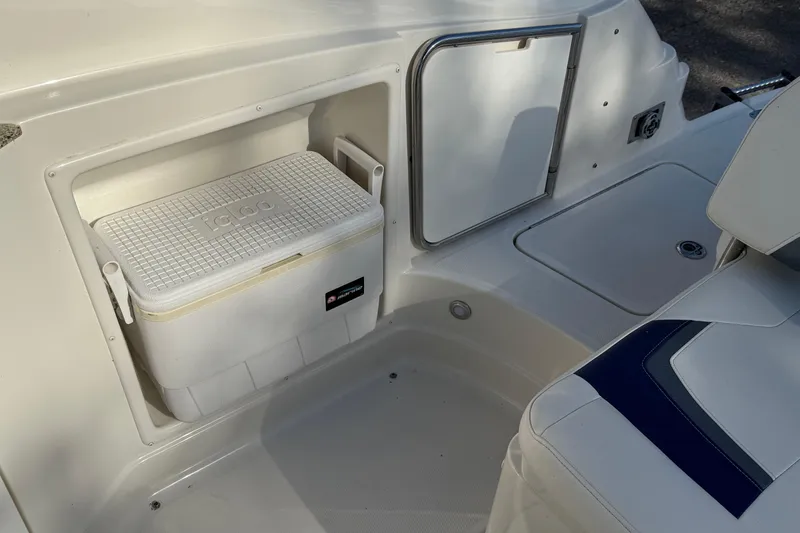 Slide: The Image of Interior of 2011 Monterey 264 FS boat with built-in Igloo cooler storage. - 18