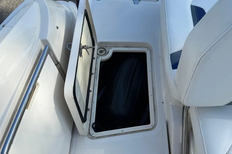 Slide: The Image of Open storage compartment on 2011 Monterey 264 FS boat interior. - 20