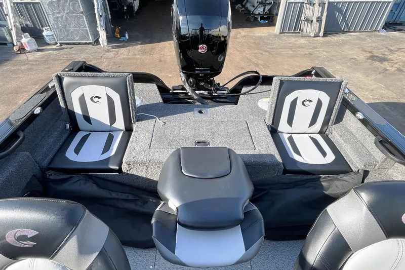 Slide: The Image of 2026 Crestliner 1750 Fish Hawk WT JS boat interior with seating and dashboard. - 2