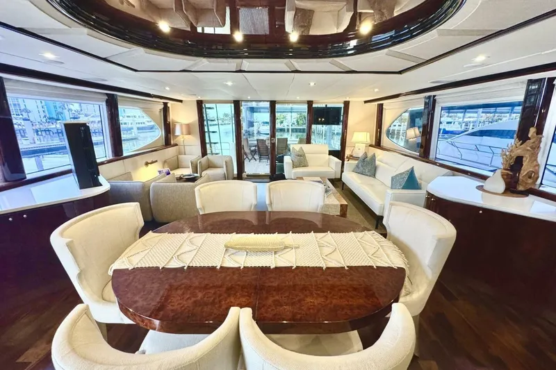 Slide: The Image of Luxurious interior of 2001 Lazzara 94 Motor Yacht with elegant dining and seating area. - 10