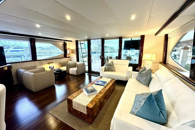 Slide: The Image of Luxurious interior of 2001 Lazzara 94 Motor Yacht with elegant seating and wooden flooring. - 14