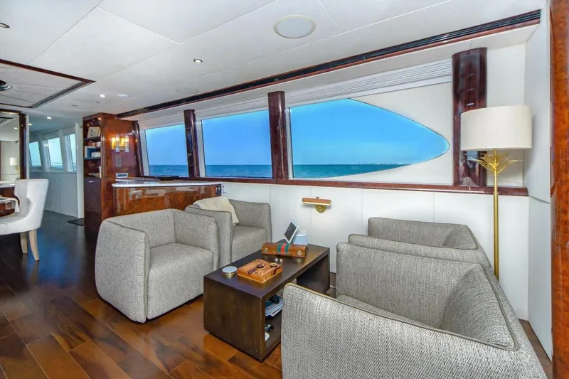 Slide: The Image of Luxurious interior of 2001 Lazzara 94 Motor Yacht with ocean view and elegant furnishings. - 16