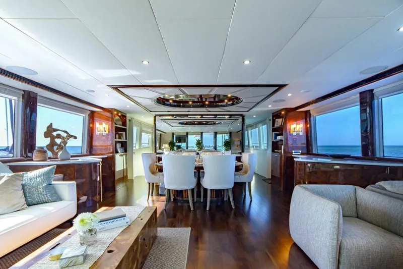 Slide: The Image of Luxurious interior of 2001 Lazzara 94 Motor Yacht with elegant dining area and ocean views. - 2
