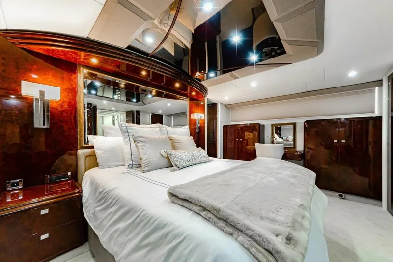 Slide: The Image of Luxurious bedroom interior of 2001 Lazzara 94 Motor Yacht with elegant wood finishes. - 29