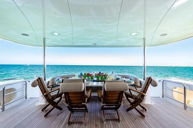 Slide: The Image of Luxurious dining area on 2001 Lazzara 94 Motor Yacht with ocean view. - 3
