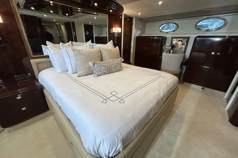 Slide: The Image of Luxurious bedroom interior of 2001 Lazzara 94 Motor Yacht with elegant bedding. - 30