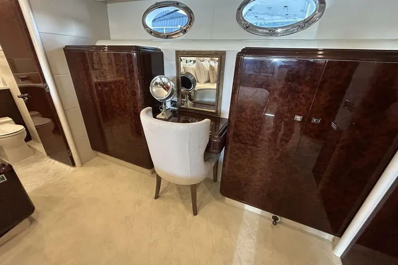 Slide: The Image of Luxurious vanity area on 2001 Lazzara 94 Motor Yacht with elegant wood finish. - 31