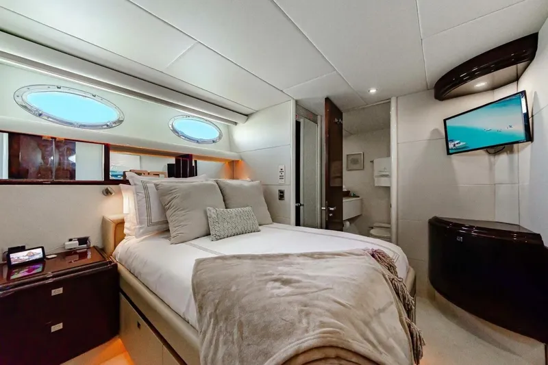 Slide: The Image of Luxurious bedroom interior of 2001 Lazzara 94 Motor Yacht with modern amenities. - 36