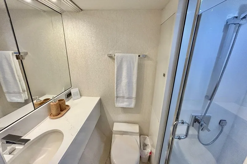 Slide: The Image of Luxurious bathroom in 2001 Lazzara 94 Motor Yacht with modern fixtures and elegant design. - 37