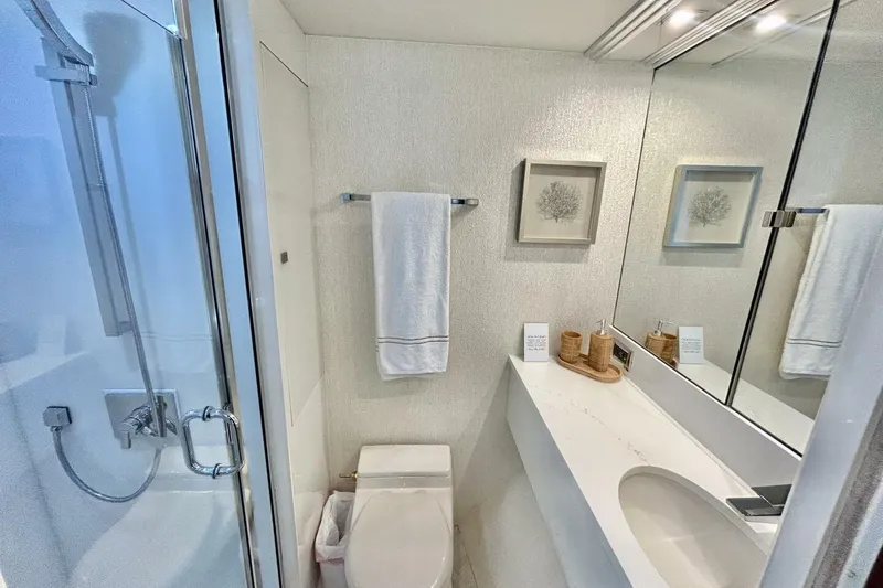 Slide: The Image of Luxurious bathroom in 2001 Lazzara 94 Motor Yacht with modern fixtures and elegant decor. - 39