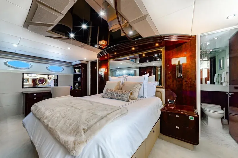 Slide: The Image of Luxurious bedroom interior of 2001 Lazzara 94 Motor Yacht with elegant furnishings. - 4