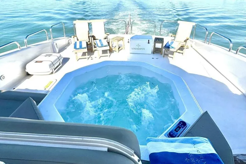 Slide: The Image of Luxurious deck of 2001 Lazzara 94 Motor Yacht with jacuzzi and sun loungers. - 45