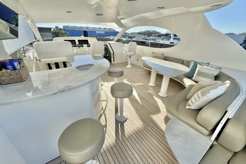 Slide: The Image of Luxurious 2001 Lazzara 94 Motor Yacht interior with elegant seating and modern design. - 51
