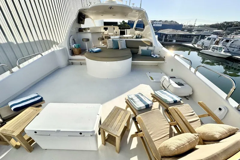 Slide: The Image of Luxurious 2001 Lazzara 94 Motor Yacht deck with seating and sun loungers. - 53