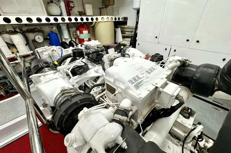 Slide: The Image of Engine room of a 2001 Lazzara 94 Motor Yacht, showcasing mechanical components and equipment. - 61