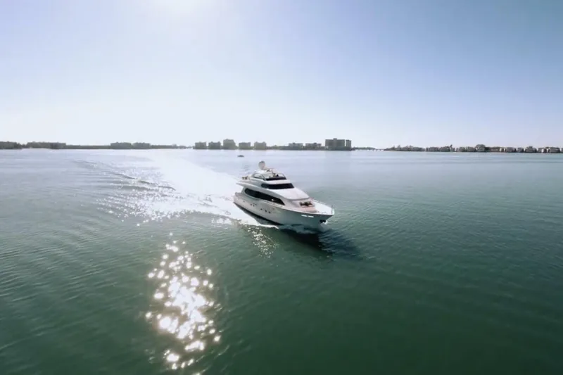 Slide: The Image of Lazzara 94 Motor Yacht 2001 cruising on calm waters under clear sky. - 66