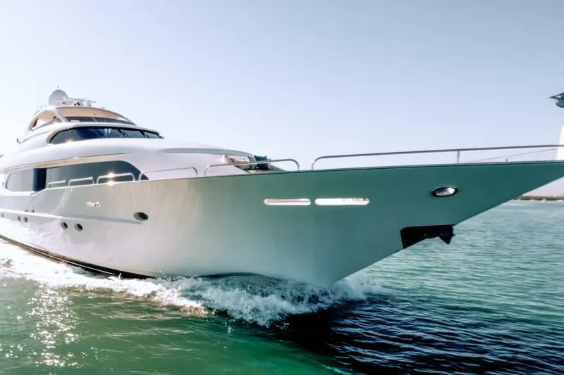 Slide: The Image of 2001 Lazzara 94 Motor Yacht cruising on clear blue water. - 72