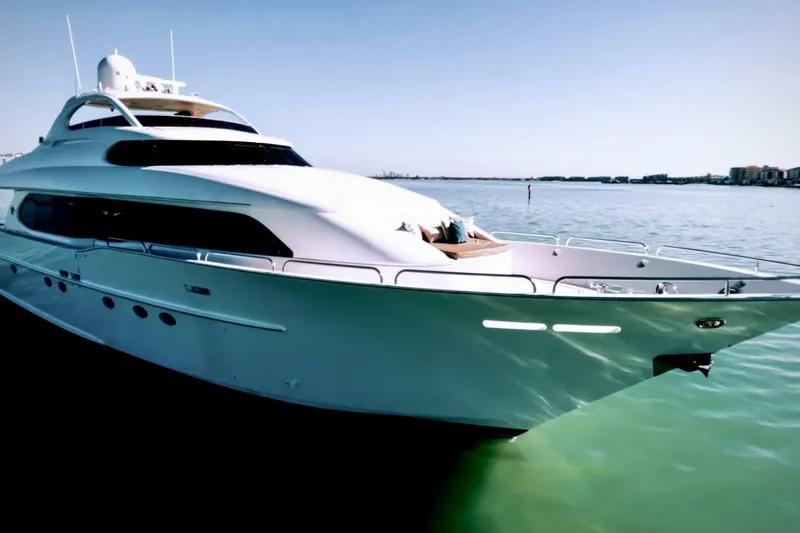 Slide: The Image of Luxury 2001 Lazzara 94 Motor Yacht on serene water, clear sky background. - 73