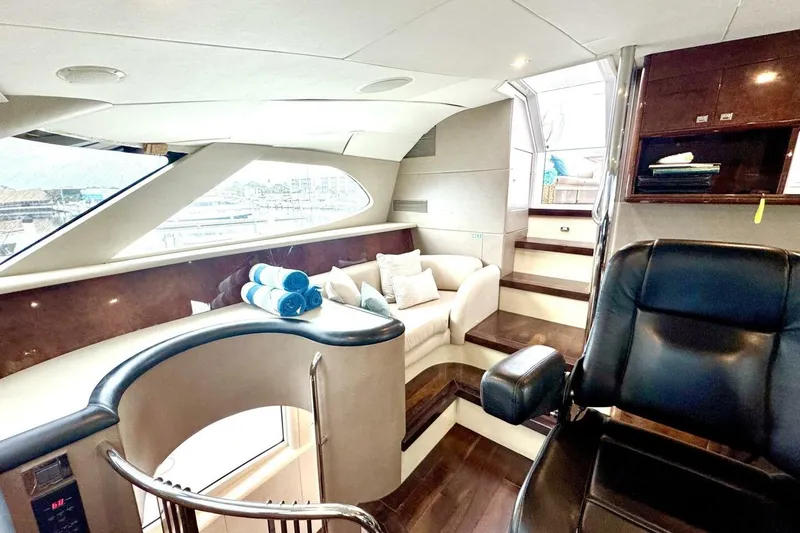 Slide: The Image of Luxurious interior of 2001 Lazzara 94 Motor Yacht with plush seating and elegant design. - 8